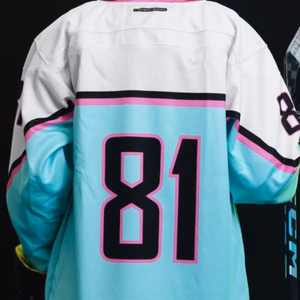 Hockey is among the most thrilling and thrilling sports across the globe. the uniforms used by the players play a significant part in performance as well as the identity of a team. Professional hockey jersey maker has a specialization in creating premium jerseys that are designed to stand up to the intense game with the same level of quality, comfort and style.
No matter if you are representing an international team, local club or a school team or even a sports brand selecting the appropriate hockey jersey manufacturer guarantees that your uniforms are long-lasting and breathable. They also look striking. Customized hockey jerseys allow teams to show their individuality by using distinctive colours, logos, and designs.
This guide provides everything you must be aware of about hockey jersey makers such as production processes material, options for customization and the best way to select the right manufacturing supplier.
What Do Hockey Jersey Manufacturers Do?
Manufacturers of hockey jerseys create, manufacture and sell jerseys designed to fit hockey athletes. These jerseys are specifically designed to withstand the demands of physical exercise while also providing ease of movement and comfort during matches.
Manufacturers usually provide:
Custom hockey jerseys
Uniforms of the team
Training jerseys
Fan jerseys, merchandise and even a few
Hockey jerseys with sublimation
Kits for teams of amateur and professional players
Many manufacturers also offer the option of private labeling which allow sports brands to sell their jerseys with their brand names.
Growing Demand for Custom Hockey Jerseys
The demand for customized sports uniforms has risen substantially due to the expansion of professional teams, school competitions as well as club hockey for amateurs.
Industry Trend
Impact on Jersey Demand
Development of amateur leagues
More uniforms are needed for team sports
College and school sports
Custom-designed jerseys for teams
Fan merchandise
Supporters buying team jerseys
Branding for sports
Teams who create strong identities
The growth of E-commerce
Access to more custom sportswear

Due to these trends that are affecting the industry, the professional hockey jersey makers are a major player in the industry of sports clothing.
Types of Hockey Jerseys Produced by Manufacturers
Different kinds of hockey jerseys are made according to their purpose and the performance needs.
1. Professional Team Jerseys
These jerseys were designed for professional players and come with high-performance fabrics, which provide toughness and comfort in match-day competition.
2. Custom Team Jerseys
Custom-designed jerseys let teams personalize their uniforms using:
Logos of the team
Names of players
Numbers
Custom colors
3. Training Jerseys
Training jerseys are made for use in practice sessions. They generally lightweight and breathable.
4. Fan Jerseys
Fan jerseys are created for fans who wish to wear team apparel during games or other events.
Materials Used in Hockey Jersey Manufacturing
The performance of a hockey jersey is based greatly on the fabric used for its production.
Common Hockey Jersey Fabrics
Fabric Type
Features
Polyester
Lightweight and moisture-wicking
Mesh Fabric
Breathable and comfy
Spandex Blends
Flexible and elastic
Performance Fabric
It is designed to last and provide sweat control

Modern hockey jerseys usually incorporate multiple fabrics to ensure the perfect balance of the comfort, strength and speed.
Benefits of working together Professional Hockey Jersey Manufacturers
A partnership with experienced manufacturers can provide numerous advantages for organizations and companies.
1. High-Quality Production
Professionally-designed manufacturers make use of advanced equipment and durable materials to produce durable jerseys.
2. Custom Design Options
Manufacturers can offer customized options, like:
Colors of the team
Graphics and logos
Names of the players and their numbers
Unique jersey patterns
3. Advanced Printing Techniques
A lot of manufacturers employ sublimation print which encases designs in fabric, ensuring that the graphics last for a long time.
4. Consistent Production
Manufacturers can manufacture large amounts of jerseys and maintain high quality.
5. Brand Development
Sports brands can develop their own product lines using Private labeling and services.
Why Choose Our Hockey Jersey Manufacturing Services
Selecting the best manufacturer is vital to ensure the highest quality and reliability.
Our Manufacturing Advantages
Feature
Benefit
Premium Materials
Soft and durable jerseys
Advanced Printing Technology
Long-lasting designs
Customization Options
Unique team identity
Strict Quality Control
Consistent product standards
Flexible Production Capacity
Ideal for large and small orders

Our aim is to create hockey jerseys with high-performance that can meet the requirements of teams and sports organisations.
How Hockey Jerseys Are Manufactured
Understanding the production process can help teams to plan their uniform designs in a way that is efficient.
Step 1: Design Development
Teams pick colors or patterns or logos to wear on their jerseys.
Step 2: Fabric Selection
Fabrics are selected by manufacturers that have the right performance for the game of hockey.
Step 3: Printing and Branding
The logos, numbers and graphics are applied by screen printing or sublimation.
Step 4: Cutting and Stitching
Fabric is cut in accordance with the design pattern, and then stitched with industrial machines.
Step 5: Quality Inspection
Each garment is tested for quality to ensure its durability and accuracy.
Step 6: Packaging and Delivery
The finished jerseys are packed and ready for shipping.
Factors That Affect Hockey Jersey Manufacturing Costs
Many factors determine the cost of customized hockey jerseys.
Main Pricing Factors
Factor
Description
Fabric Quality
Premium fabrics boost production costs
Custom Design Complexity
The intricate designs require additional work
Order Quantity
Larger orders reduce cost per unit
Printing Technique
Sublimation and embroidery can increase the cost
Packaging
Packaging that is custom made can cost more.

Understanding these elements helps teams and brands to plan their budgets efficiently.
How to Choose the Best Hockey Jersey Manufacturer
Choosing the best manufacturer is a crucial choice for both sports teams and companies.
Important Selection Criteria
Experience in the manufacture of sportswear
The quality of the materials employed
Custom design capabilities
Production capacity
Reliable delivery timelines
Standards for quality control
Partnering with a trusted manufacturer guarantees high-quality products and reliable service.
Future Trends in Hockey Jersey Manufacturing
The industry of sportswear is constantly evolving with the latest technologies and advancements.
Emerging Trends
Sustainable sportswear fabrics
Lightweight materials for performance
Wearable technology for sports that is smart.
Advanced sublimation printing
Personalized sports uniforms
Companies that adopt these new trends will help teams stay modern and competitive.
Frequently Asked Questions (FAQs)
1. What kind of hockey jerseys do manufacturers make?
Manufacturers of hockey jerseys create customized jerseys, uniforms for teams training kits, as well as fan merchandise.
2. What are the materials used in hockey jerseys?
The most common materials are mesh fabrics, polyester or performance blends created for durability and breathability.
3. Can hockey jerseys be made to order?
Most manufacturers provide the option of customizing the team logo, player names as well as numbers and colors.
4. What printing techniques are employed to print hockey jerseys?
The most popular methods are the sublimation method, printing on screens and embroidery.
5. Can hockey jerseys be used to be used as team logos?
Yes, custom jerseys can help teams create a distinct identity by using colors, logos and designs that are unique.
6. Are manufacturers able to handle bulk orders?
Professional hockey jersey makers typically offer large-scale production for teams, leagues, as well as sports brands.
Start Your Custom Hockey Jersey Production Today
Top-quality hockey jerseys are crucial for teams who wish to be confident and display their brand with pride. Professional manufacturers of hockey jerseys have the experience in materials, technology, and equipment required to design fashionable and durable uniforms.
If you're a sports club, team, or brand, working with a trusted manufacturer guarantees that your uniforms meet the highest standards and reflect the unique style of your team. Customized hockey jerseys do more than increase performance, they also boost the team's unity and increase brand recognition.
